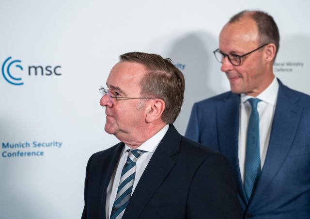German Defence Minister Boris Pistorius (L) and German Chancellor Friedrich Merz arrive for a Signing Ceremony between Norway and Germany during the 62nd Munich Security Conference (MSC) on February 14, 2026 in Munich, southern Germany.  (Photo by Michael BIHLMAYER / POOL / AFP)