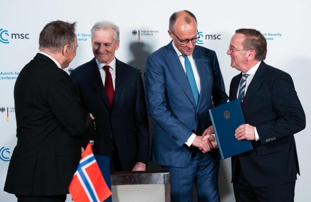 (L-R) Norway's Defence Minister Tore O. Sandvik, Norwegian Prime Minister Jonas Gahr Store, German Chancellor Friedrich Merz and German Defence Minister Boris Pistorius pose after a Signing Ceremony during the 62nd Munich Security Conference (MSC) on February 14, 2026 in Munich, southern Germany.  (Photo by Michael BIHLMAYER / POOL / AFP)