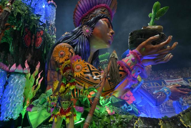 Revellers of the Academicos do Tatuape samba school perform during the carnival parade at the Anhembi Sambadrome in Sao Paulo, Brazil, on February 14, 2026. (Photo by NELSON ALMEIDA / AFP)