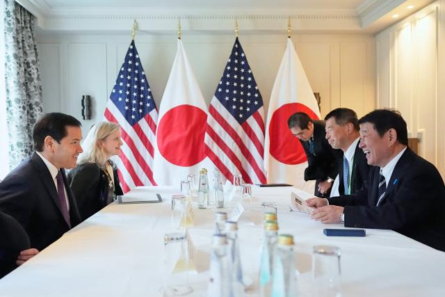 US Secretary of State Marco Rubio (L) meets with Japan's Foreign Minister Toshimitsu Motegi (R) for talks on the sidelines of the  during the 62nd Munich Security Conference (MSC) on February 14, 2026 in Munich, southern Germany. Heads of state and government as well as foreign and defence ministers from all over the world are expected to attend the security policy talks from February 13 to 15, 2026. (Photo by Alex Brandon / POOL / AFP)