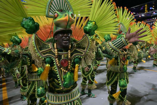 Revellers of the Dragoes da Real samba school perform during the carnival parade at the Anhembi Sambadrome in Sao Paulo, Brazil, on February 14, 2026. (Photo by NELSON ALMEIDA / AFP)