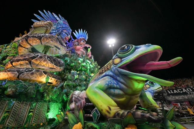 Revellers of the Dragoes da Real samba school perform during the carnival parade at the Anhembi Sambadrome in Sao Paulo, Brazil, on February 14, 2026. (Photo by NELSON ALMEIDA / AFP)
