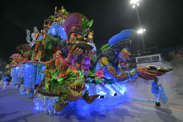 Revellers of the Academicos do Tatuape samba school perform during the carnival parade at the Anhembi Sambadrome in Sao Paulo, Brazil, on February 14, 2026. (Photo by NELSON ALMEIDA / AFP)