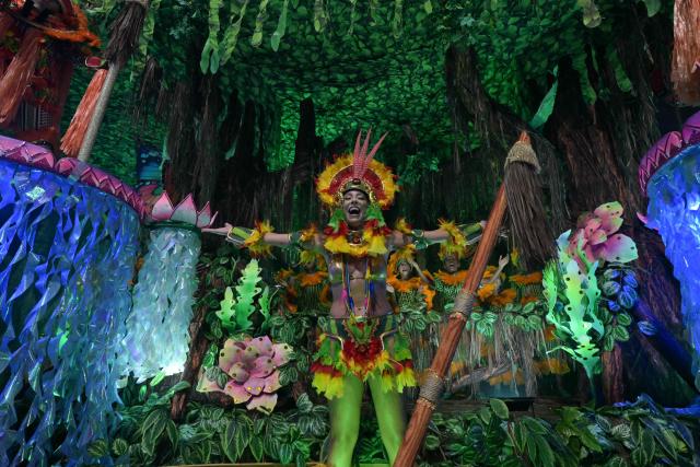 Revellers of the Academicos do Tatuape samba school perform during the carnival parade at the Anhembi Sambadrome in Sao Paulo, Brazil, on February 14, 2026. (Photo by NELSON ALMEIDA / AFP)