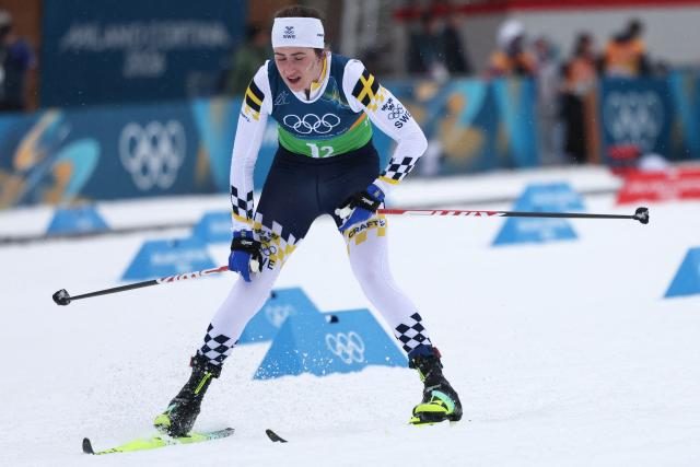 Sweden's Ebba Andersson reacts after handing her relay during the cross-country women's 4 x 7,5km relay event of the Milano Cortina 2026 Winter Olympic Games at Tesero Cross-Country Skiing Stadium in Lago di Tesero (Val di Fiemme), on February 14, 2026. (Photo by Anne-Christine POUJOULAT / AFP)
