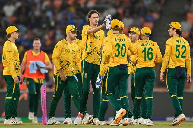 South Africa's Marco Jansen (3L) celebrates with teammates after taking the wicket of New Zealand's Tim Seifert during the 2026 ICC Men's T20 Cricket World Cup group stage match between New Zealand and South Africa at the Narendra Modi Stadium in Ahmedabad on February 14, 2026. (Photo by Shammi MEHRA / AFP)
