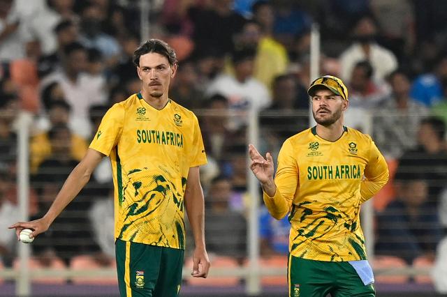 South Africa's Marco Jansen (L) gestures alongside captain Aiden Markram during the 2026 ICC Men's T20 Cricket World Cup group stage match between New Zealand and South Africa at the Narendra Modi Stadium in Ahmedabad on February 14, 2026. (Photo by Shammi MEHRA / AFP)