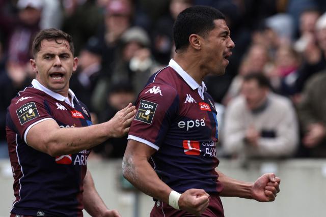 Bordeaux-Begles' New-Zealand wing Salesi Rayasi (R) celebrates after scoring a try during the French Top14 rugby union match between Union Bordeaux-Begles (UBB) and Castres Olympique at the Chaban-Delmas Stadium in Bordeaux, south-western France on February 14, 2026. (Photo by Valentine CHAPUIS / AFP)