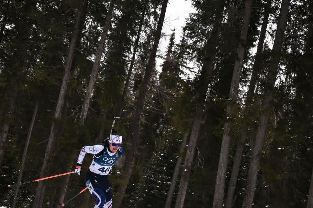 France's Julia Simon competes in the women's biathlon 7,5km sprint event during the Milano Cortina 2026 Winter Olympic Games at the Anterselva Biathlon Arena (Sudtirol Arena) in Anterselva (Val Pusteria) on February 14, 2026. (Photo by Marco BERTORELLO / AFP)