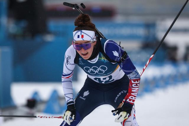 France's Lou Jeanmonnot reacts after crossing the finish line during the women's biathlon 7,5km sprint event during the Milano Cortina 2026 Winter Olympic Games at the Anterselva Biathlon Arena (Sudtirol Arena) in Anterselva (Val Pusteria) on February 14, 2026. (Photo by FRANCK FIFE / AFP)