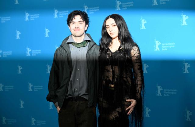 Scottish director Aidan Zamiri and British actress Charli xcx pose during a photocall for the film 'The Moment' presented in the Panorama section at the 76th Berlinale, Europe's first major film festival of the year, in Berlin on February 14, 2026. (Photo by RALF HIRSCHBERGER / AFP)