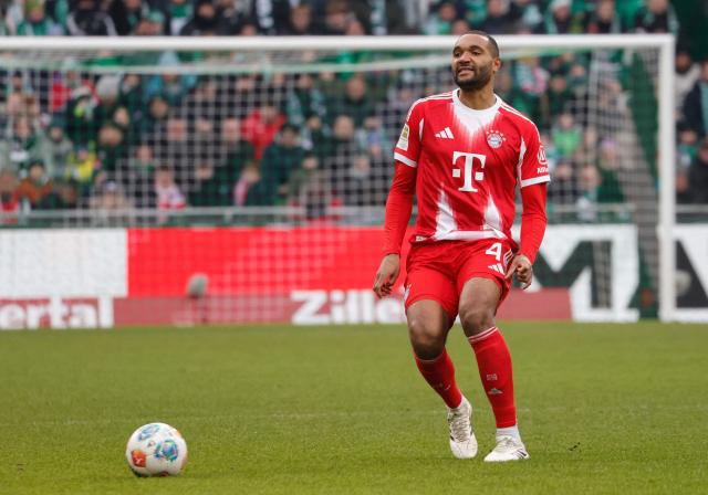 Bayern Munich's German defender #04 Jonathan Tah plays the ball during the German first division Bundesliga football match between SV Werder Bremen and FC Bayern Munich in Bremen, northern Germany February 14, 2026 (Photo by Focke Strangmann / AFP) / DFL REGULATIONS PROHIBIT ANY USE OF PHOTOGRAPHS AS IMAGE SEQUENCES AND/OR QUASI-VIDEO