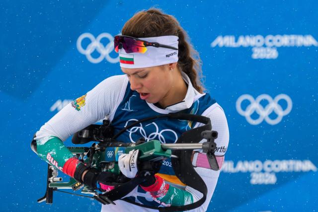 Bulgaria's Lora Hristova loads her rifle at the shooting range during the women's biathlon 7,5km sprint event during the Milano Cortina 2026 Winter Olympic Games at the Anterselva Biathlon Arena (Sudtirol Arena) in Anterselva (Val Pusteria) on February 14, 2026. (Photo by FRANCOIS-XAVIER MARIT / AFP)