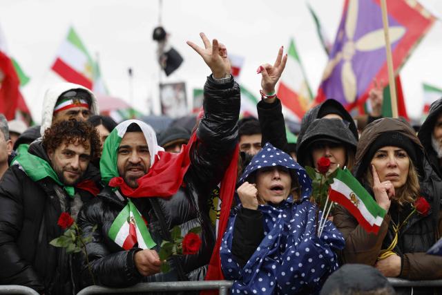 People take part in a demonstration of the Iranian opposition on February 14, 2026 at the Theresienwiese fair grounds in Munich, southern Germany, on the sidelines of the 62nd Munich Security Conference (MSC). About 200,000 people joined the demonstration against the Iranian government, police said, as world leaders gathered nearby for a security conference. The pro-monarchist protesters rallied on the German city's Theresienwiese fairgrounds, denouncing the leadership of Iran's Islamic Republic following the deadly repression of nationwide protests in January 2026. (Photo by Michaela STACHE / AFP)
