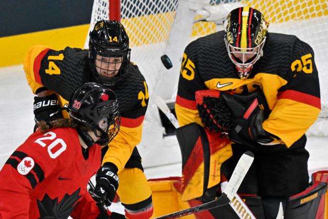 Germany's #35 Sandra Abstreiter defends the goal during the women's quarter final ice hockey match between Canada and Germany at the Milano Rho Ice Hockey Arena at the Milano Cortina 2026 Winter Olympic Games in Milan, on February 14, 2026. (Photo by Alexander NEMENOV / AFP)
