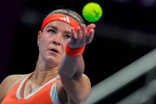 Czech Republic's Karolina Muchova serves to Canada's Victoria Mboko during their women’s singles final match at the Qatar Open tennis tournament in Doha on February 14, 2026. (Photo by Karim JAAFAR / AFP)