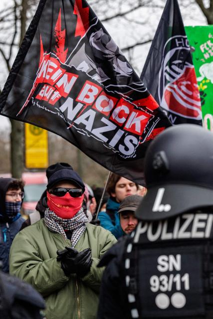 Left-wing demonstrators protest against a march of right-wing extremists in Dresden, eastern Germany, on February 14, 2026. Right-wing extremists have organised a demonstration on the occasion of the 81st anniversary of the bombing of Dresden during WWII, as the action alliance "Dresden Wi(e)dersetzen" was calling for a countermarch. (Photo by JENS SCHLUETER / AFP)