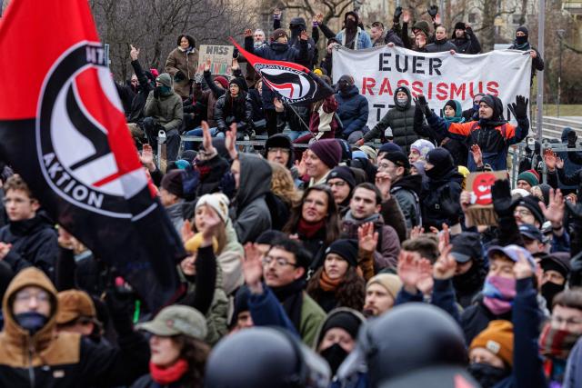 Left-wing demonstrators protest against a march of right-wing extremists in Dresden, eastern Germany, on February 14, 2026. Right-wing extremists have organised a demonstration on the occasion of the 81st anniversary of the bombing of Dresden during WWII, as the action alliance "Dresden Wi(e)dersetzen" was calling for a countermarch. (Photo by JENS SCHLUETER / AFP)