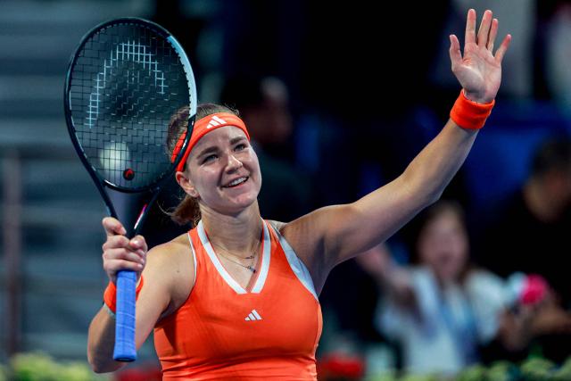 Czech Republic's Karolina Muchova reacts after beating Canada's Victoria Mboko to win in the women’s singles final match at the Qatar Open tennis tournament in Doha on February 14, 2026. (Photo by Karim JAAFAR / AFP)