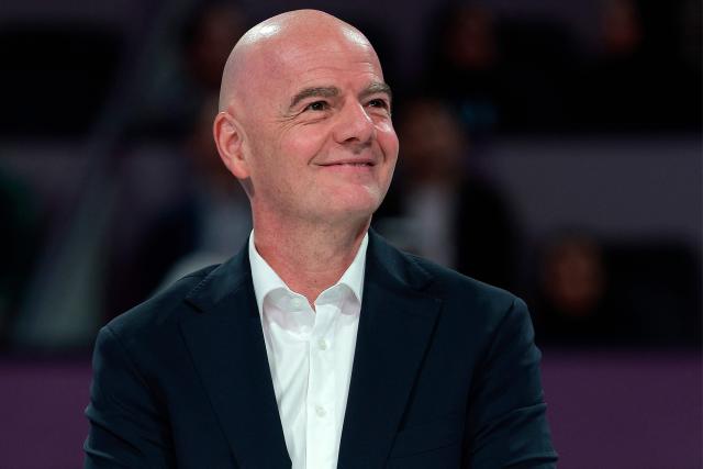 International Association Football Federation (FIFA) President Gianni Infantino looks on at the end of the women’s singles final match, at the Qatar Open tennis tournament in Doha on February 14, 2026. (Photo by Karim JAAFAR / AFP)
