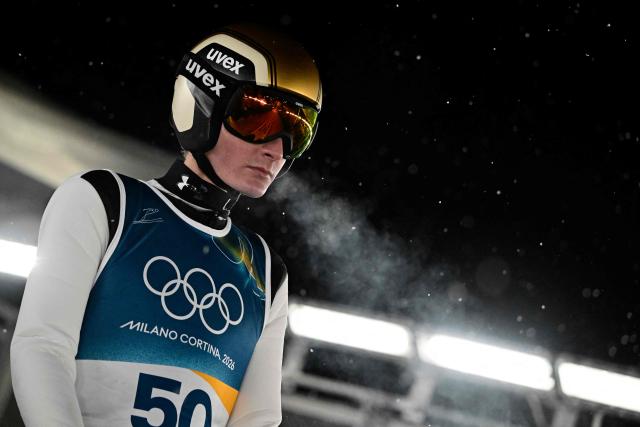 Slovenia's Domen Prevc reacts prior to jumping during the trial round of the men's large hill individual ski jumping of the Milano Cortina 2026 Winter Olympic Games at Predazzo Ski Jumping Stadium in Predazzo (Val di Fiemme), on February 14, 2026. (Photo by Tobias SCHWARZ / AFP)