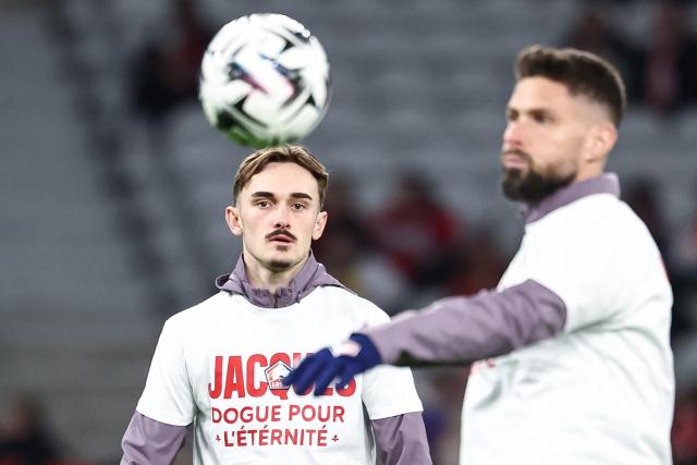 Lille's Norwegian forward #14 Marius Broholm (L) eyes the ball during warm-up next to his teammate Lille's French forward #09 Olivier Giroud ahead of the French L1 football match between LOSC Lille and Stade Brestois 29 at the Stade Pierre-Mauroy in Villeneuve-d'Ascq, northern France, on February 14, 2026. (Photo by Sameer Al-DOUMY / AFP)