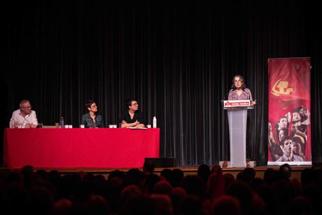 French far-left party Lutte Ouvriere (LO) Paris mayoral candidate Marielle Saulnier (R) delivers a speech as (LtoR) French far left party Lutte Ouvriere (LO) spokespersons Jean-Pierre Mercier and Nathalie Arthaud  and LO candidate in Bagnolet Aurelie Jochaud look on during a meeting lauching the party's election campaign for the March 2026 mayoral election in Paris' Ile-de-France region at the Mutualite venue in Paris on February 14, 2026. (Photo by Guillaume BAPTISTE / AFP)