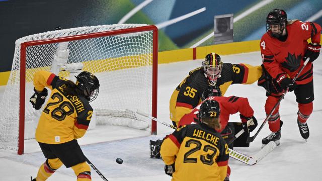 Canada's #29 Marie-Philip Poulin (C) shoots to score her team's fifth goal during the women's quarter final ice hockey match between Canada and Germany at the Milano Rho Ice Hockey Arena at the Milano Cortina 2026 Winter Olympic Games in Milan, on February 14, 2026. (Photo by Alexander NEMENOV / AFP)