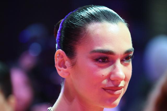 English singer and songwritter Dua Lipa poses on the red carpet for the premiere of the film "Rosebush Pruning" presented in competition at the 76th Berlinale, Europe's first major film festival of the year, in Berlin on February 14, 2026. (Photo by RALF HIRSCHBERGER / AFP)