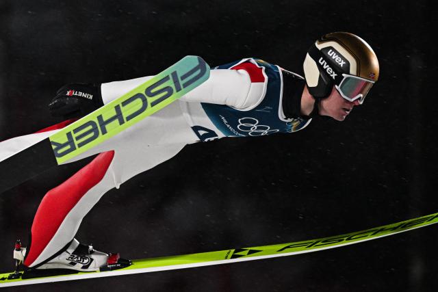 Norway's Kristoffer Eriksen Sundal jumps during the 1st round of the men's large hill individual ski jumping of the Milano Cortina 2026 Winter Olympic Games at Predazzo Ski Jumping Stadium in Predazzo (Val di Fiemme), on February 14, 2026. (Photo by Javier SORIANO / AFP)