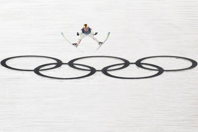 Norway's Kristoffer Eriksen Sundal jumps during the 1st round of the men's large hill individual ski jumping of the Milano Cortina 2026 Winter Olympic Games at Predazzo Ski Jumping Stadium in Predazzo (Val di Fiemme), on February 14, 2026. (Photo by Anne-Christine POUJOULAT / AFP)