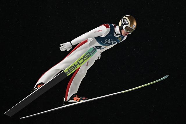 Austria's Jan Hoerl jumps during the 1st round of the men's large hill individual ski jumping of the Milano Cortina 2026 Winter Olympic Games at Predazzo Ski Jumping Stadium in Predazzo (Val di Fiemme), on February 14, 2026. (Photo by Javier SORIANO / AFP)