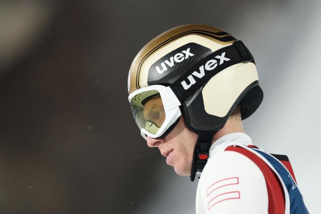 Austria's Jan Hoerl reacts in the finish area after jumping during the 1st round of the men's large hill individual ski jumping of the Milano Cortina 2026 Winter Olympic Games at Predazzo Ski Jumping Stadium in Predazzo (Val di Fiemme), on February 14, 2026. (Photo by Anne-Christine POUJOULAT / AFP)