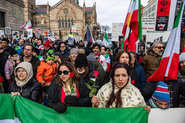 Protestors call for regime change in Iran, US intervention and for the end of the Islamic Republic at a rally in Copley Square in Boston, Massachusetts, on February 14, 2026. The protest comes after the bloody crackdown on protesters last month, while US President Donald Trump has been massing warships in the Middle East and declared Friday that a change of government in Iran would be the "best thing that could happen". (Photo by Joseph Prezioso / AFP)