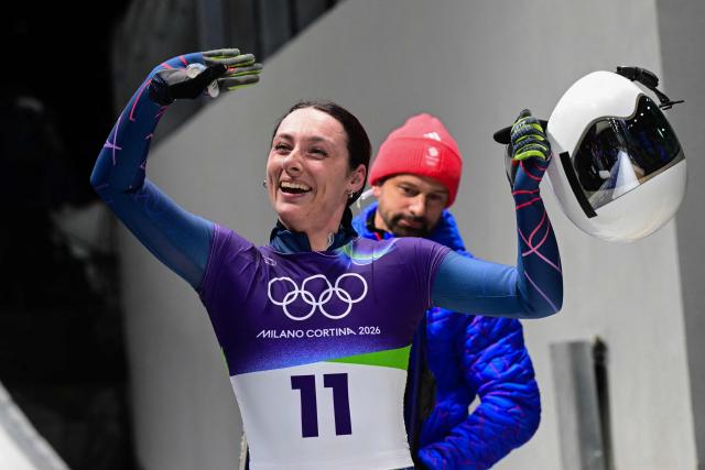 Britain's Freya Tarbit reacts after competing in the skeleton women's heat 4 at Cortina Sliding Centre during the Milano Cortina 2026 Winter Olympic Games in Cortina d'Ampezzo on February 14, 2026. (Photo by Stefano RELLANDINI / AFP)