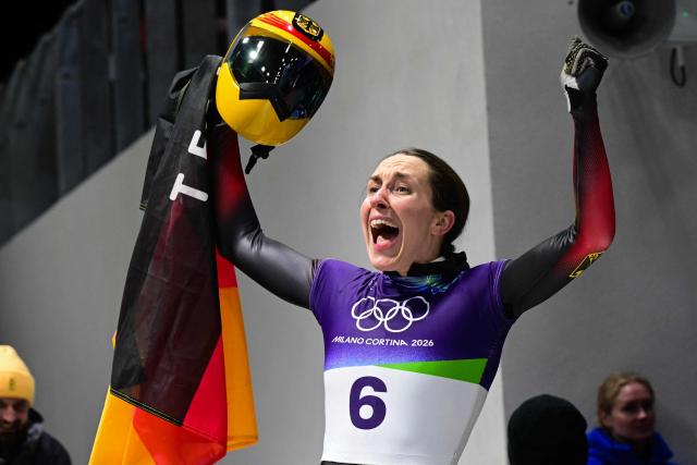 Germany's Jacqueline Pfeifer reacts after competing in the skeleton women's heat 4 at Cortina Sliding Centre during the Milano Cortina 2026 Winter Olympic Games in Cortina d'Ampezzo on February 14, 2026. (Photo by Stefano RELLANDINI / AFP)