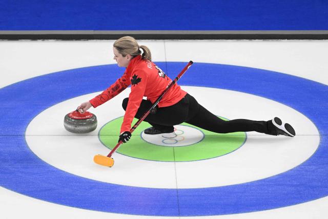 Canada's Tracy Fleury delivers the stone during  the curling women's round robin between Canada and Switzerland during the Milano Cortina 2026 Winter Olympic Games at the Cortina Curling Olympic Stadium in Cortina d’Ampezzo on February 14, 2026. (Photo by Tiziana FABI / AFP)