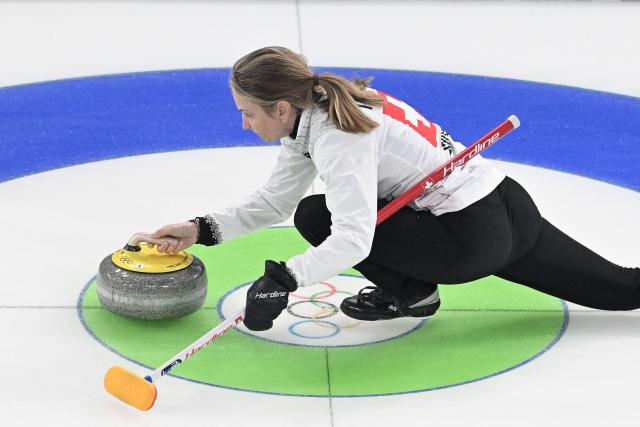 Switzerland's Silvana Tirinzoni delivers the stone during the curling women's round robin between Canada and Switzerland during the Milano Cortina 2026 Winter Olympic Games at the Cortina Curling Olympic Stadium in Cortina d’Ampezzo on February 14, 2026. (Photo by Tiziana FABI / AFP)