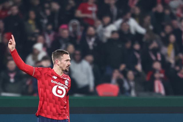 Lille's French midfielder #28 Gaetan Perrin celebrates after scoring Lille's first goal during the French L1 football match between LOSC Lille and Stade Brestois 29 at the Stade Pierre-Mauroy in Villeneuve-d'Ascq, northern France, on February 14, 2026. (Photo by Sameer Al-DOUMY / AFP)