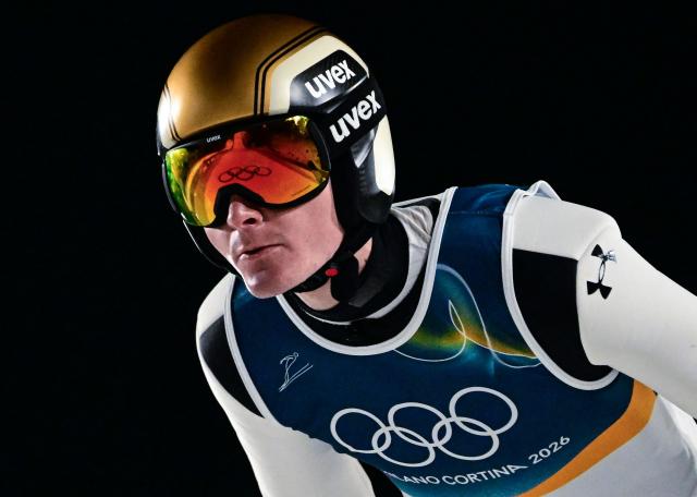 Slovenia's Domen Prevc jumps during the final round of the men's large hill individual ski jumping of the Milano Cortina 2026 Winter Olympic Games at Predazzo Ski Jumping Stadium in Predazzo (Val di Fiemme), on February 14, 2026. (Photo by Tobias SCHWARZ / AFP)