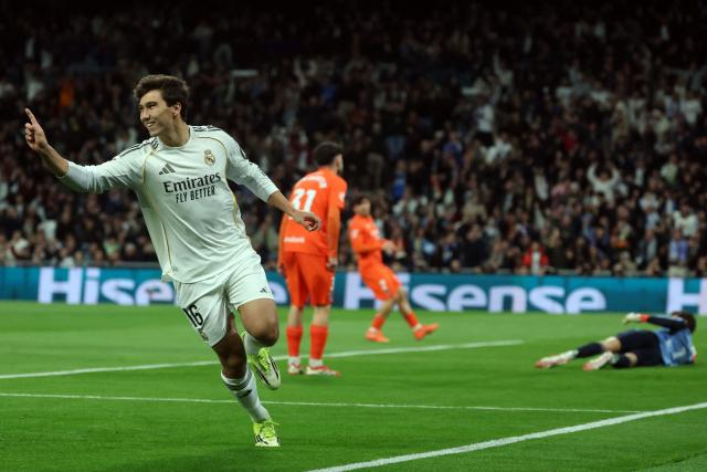 Real Madrid's Spanish forward #16 Gonzalo Garcia (L) celebrates scoring the opening goal during the Spanish league football match between Real Madrid CF and Real Sociedad at Santiago Bernabeu Stadium in Madrid on February 14, 2026. (Photo by Pierre-Philippe MARCOU / AFP)