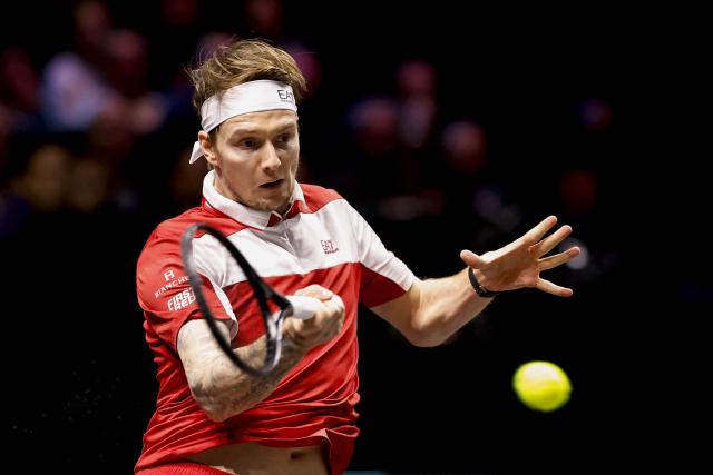 Kazakhstan's Alexander Bublik returns the ball to Canada's Felix Auger-Aliassime during the quarterfinals of the Rotterdam tennis tournament at Rotterdam Ahoy, on February 14, 2026. (Photo by Bas CZERWINSKI / ANP / AFP) / Netherlands OUT