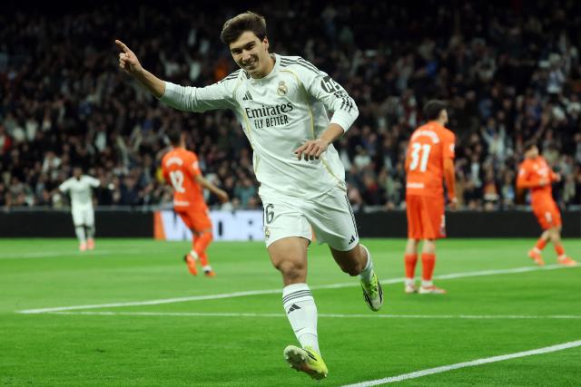 Real Madrid's Spanish forward #16 Gonzalo Garcia celebrates scoring the opening goal during the Spanish league football match between Real Madrid CF and Real Sociedad at Santiago Bernabeu Stadium in Madrid on February 14, 2026. (Photo by Pierre-Philippe MARCOU / AFP)
