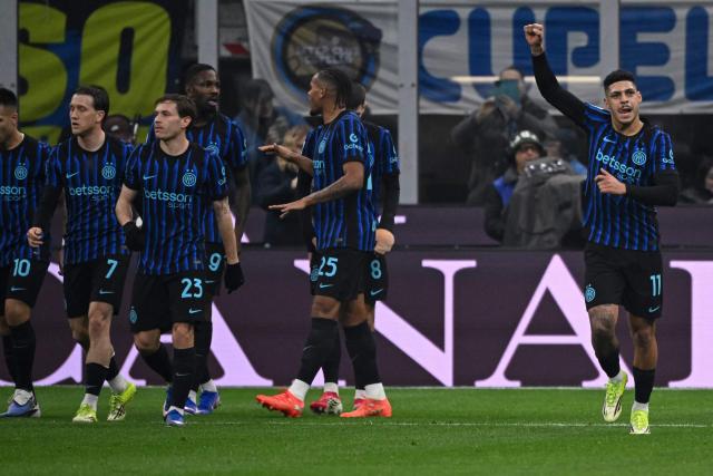 Inter Milan's Brazilian forward #11 Luis Henrique (R) celebrates after scoring his team's first goal during the Italian Serie A football match between Inter Milan and Juventus at the San Siro Stadium in Milan, on February 14, 2026. (Photo by Piero CRUCIATTI / AFP)
