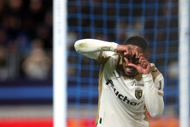 Lens' French forward #22 Wesley Said celebrates after scoring Lens' first goal during the French L1 football match between Paris FC and RC Lens at the Stade Jean-Bouin in Paris on February 14, 2026. (Photo by ALAIN JOCARD / AFP)