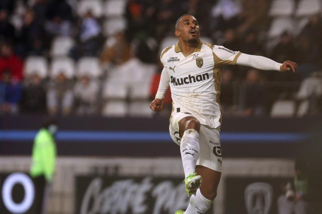 Lens' French forward #22 Wesley Said celebrates after scoring Lens' second goal during the French L1 football match between Paris FC and RC Lens at the Stade Jean-Bouin in Paris on February 14, 2026. (Photo by ALAIN JOCARD / AFP)