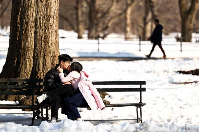 A couple kisses in Central Park on Valentine’s day in New York on February 14, 2026. (Photo by Charly TRIBALLEAU / AFP)