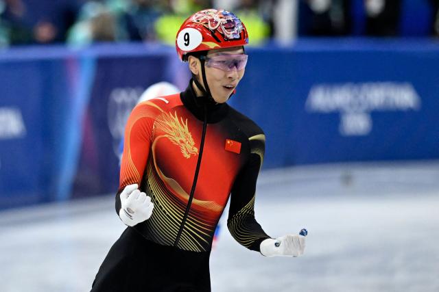 China's Sun Long reacts after competing in the short track speed skating men's 1500m semi-final during the Milano Cortina 2026 Winter Olympic Games at Milano Ice Skating Arena in Milan on February 14, 2026. (Photo by WANG Zhao / AFP)