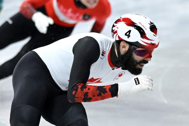 Canada's Steven Dubois competes in the short track speed skating men's 1500m semi-final during the Milano Cortina 2026 Winter Olympic Games at Milano Ice Skating Arena in Milan on February 14, 2026. (Photo by WANG Zhao / AFP)