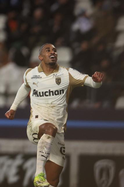 Lens' French forward #22 Wesley Said celebrates after scoring Lens' second goal during the French L1 football match between Paris FC and RC Lens at the Stade Jean-Bouin in Paris on February 14, 2026. (Photo by ALAIN JOCARD / AFP)